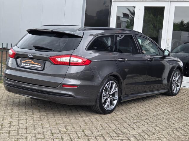 Ford MONDEO Wagon 1.5 ST Line NAVIGATIE|CAMERA|XENON LED|LEDER|KEY LESSGO &ENTRY|GETINT GLAS|TREKHAAK AFNEEMBAAR|18 INCH Maandag tot Vrijdag geopend van 09.00 tot 20.00 uur en Zaterdag van 09.00 tot 18.00 uur