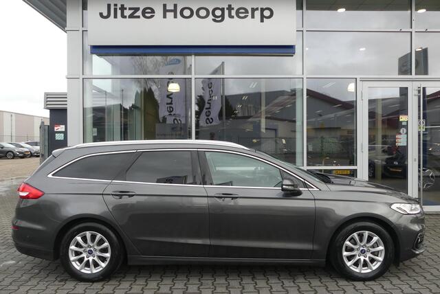 Ford MONDEO Wagon 2.0 IVCT HEV Titanium ELEKT. TREKHAAK (750KG), WINTER PACK, MEMORY, CRUISE, CLIMA, NAVI, CAMERA, PDC V&A, APPLE CARPLAY/ANDROID AUTO, BLIS, KEYLESS, ELEKT. PASSAGIERSSTOEL, ELEKT. ACHTERKLEP, ADAPTIEVE KOPLAMPEN, LANE ASSIST, 57.812KM