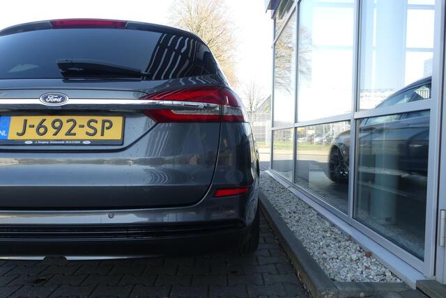 Ford MONDEO Wagon 2.0 IVCT HEV Titanium 18 INCH, ELEKT. TREKHAAK (750KG), WINTER PACK, MEMORY, CRUISE, CLIMA, NAVI, CAMERA, PDC V&A, APPLE CARPLAY/ANDROID AUTO, BLIS, KEYLESS, ELEKT. PASSAGIERSSTOEL, ELEKT. ACHTERKLEP, ADAPTIEVE KOPLAMPEN, LANE ASSIST, 57.812KM