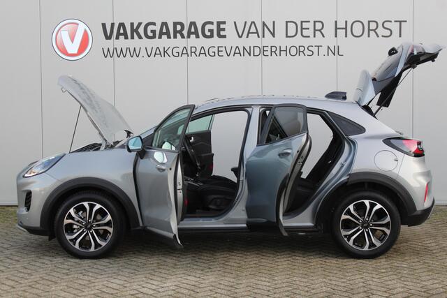 Ford PUMA 1.0-125pk EcoBoost Mild-Hybrid Titanium. Fabrieksgarantie t/m 23-03-2029 ! Werkelijk in nieuwstaat maar wel ruim ¤. 6.000,- beneden de nieuwprijs ! Autm. airco, stoel-, stuur- en voorraamverw., adapt. cruise cntrl, side- en lane assist, navigatie, telefoo