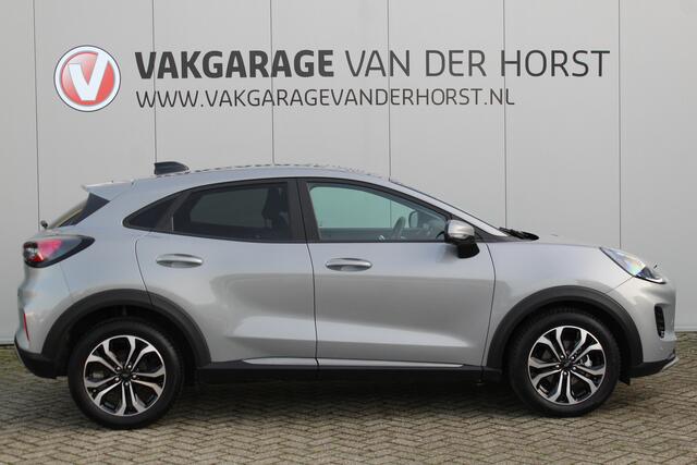 Ford PUMA 1.0-125pk EcoBoost Mild-Hybrid Titanium. Fabrieksgarantie t/m 23-03-2029 ! Werkelijk in nieuwstaat maar wel ruim ¤. 6.000,- beneden de nieuwprijs ! Autm. airco, stoel-, stuur- en voorraamverw., adapt. cruise cntrl, side- en lane assist, navigatie, telefoo