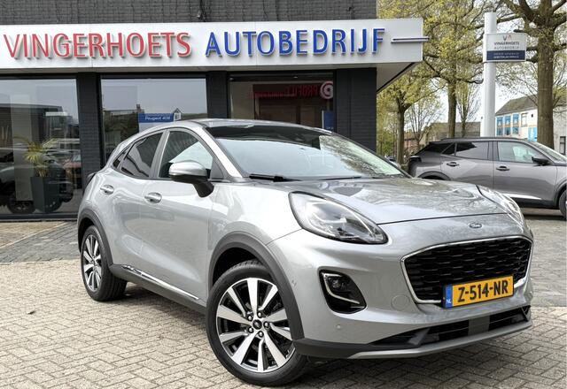 Ford PUMA 125 Pk Titanium X Benzine * Navigatie * Adaptive Cruise Control * Achteruitrij Camera * 18" L.M. Velgen * Vingerhoets; Vierde Generatie Eersteklas Service. Al meer dan 100 jaar een begrip in de Brabantse Kempen.
