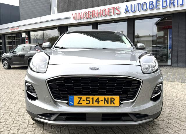 Ford PUMA 125 Pk Titanium X Benzine * Navigatie * Adaptive Cruise Control * Achteruitrij Camera * 18" L.M. Velgen * Vingerhoets; Vierde Generatie Eersteklas Service. Al meer dan 100 jaar een begrip in de Brabantse Kempen.
