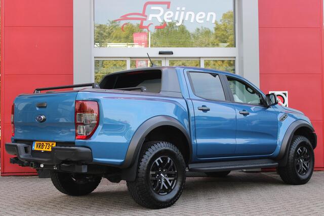 Ford RANGER 2.0 EcoBlue 214PK AUTOMAAT RAPTOR | 2500KG TREKGEWICHT | TREKHAAK | 17" "DYNO GREY" LICHTMETALEN VELGEN | 8-WEG ELEKTRISCH VERSTELBARE VOORSTOELEN | ALL TERRAIN BANDEN | FORD PERFORMANCE OPHANGING | ZWARTE SPIEGELKAPPEN | ZWARTE SIDE STEPS MET RAPTOR LOGO