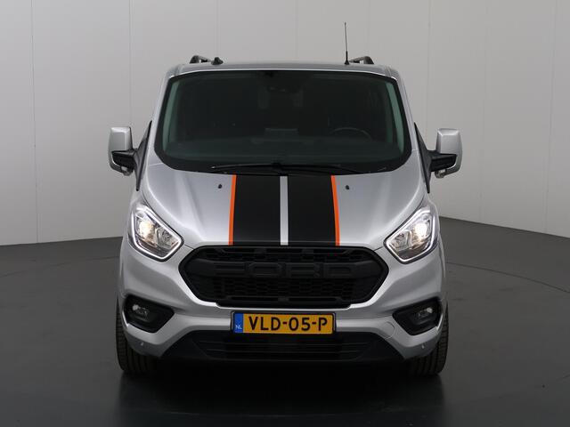 Ford TRANSIT CUSTOM 300 2.0 TDCI L2 H1 | DC | SPORT | BI-XENON | TREKHAAK 2800 KG AHW | NAVIGATIE | STOELVERWARMING | CRUISE CONTROL | 18" LICHTMETALEN WIELEN | AIRCO | DAK RAILING