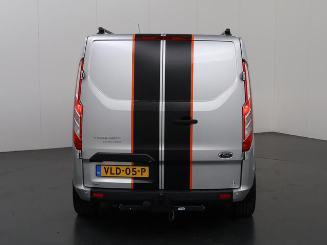 Ford TRANSIT CUSTOM 300 2.0 TDCI L2 H1 | DC | SPORT | BI-XENON | TREKHAAK 2800 KG AHW | NAVIGATIE | STOELVERWARMING | CRUISE CONTROL | 18" LICHTMETALEN WIELEN | AIRCO | DAK RAILING