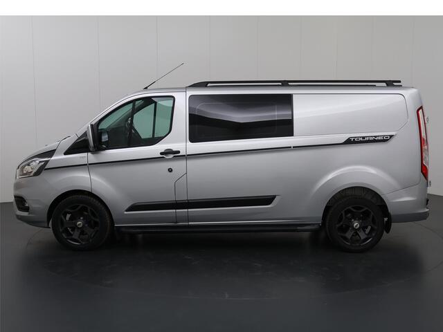 Ford TRANSIT CUSTOM 300 2.0 TDCI L2 H1 | DC | SPORT | BI-XENON | TREKHAAK 2800 KG AHW | NAVIGATIE | STOELVERWARMING | CRUISE CONTROL | 18" LICHTMETALEN WIELEN | AIRCO | DAK RAILING