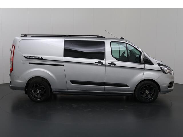 Ford TRANSIT CUSTOM 300 2.0 TDCI L2 H1 | DC | SPORT | BI-XENON | TREKHAAK 2800 KG AHW | NAVIGATIE | STOELVERWARMING | CRUISE CONTROL | 18" LICHTMETALEN WIELEN | AIRCO | DAK RAILING