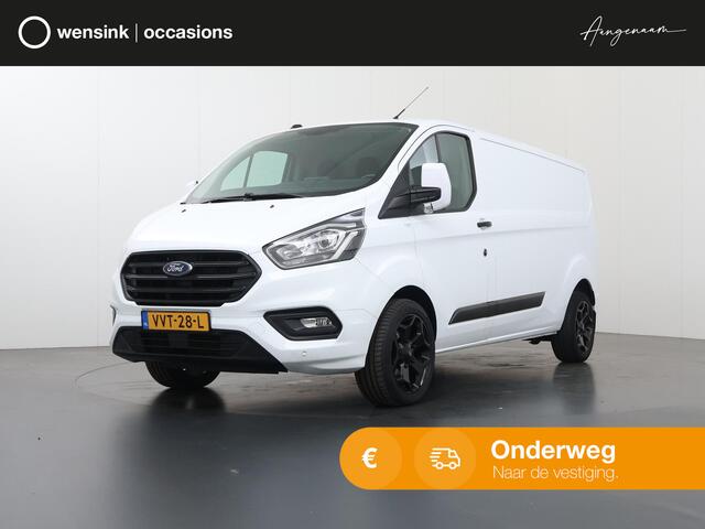 Ford TRANSIT CUSTOM 300 2.0 TDCI | 130 PK | L2 H1 | TREND | STOELVERWARMING | PARKEERSENSOREN | TREKHAAK | CARPLAY | ANDROID AUTO | AIRCO | CRUISE | 18" LICHTMETALEN WIELEN | 3-ZITS | VOORRUITVERWARMING