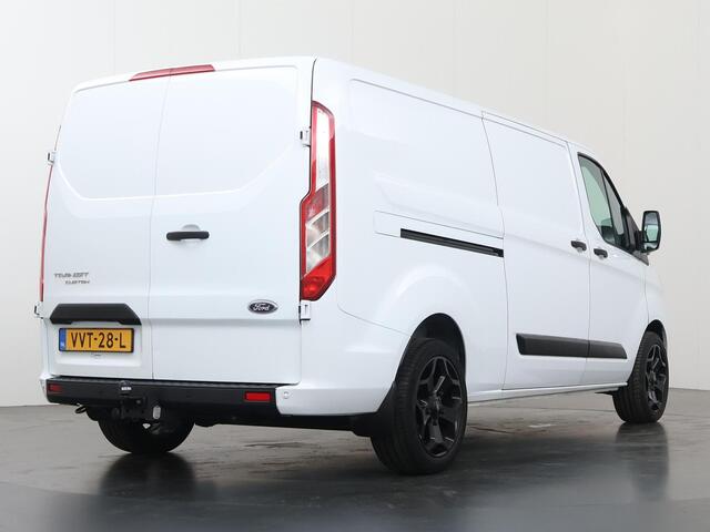 Ford TRANSIT CUSTOM 300 2.0 TDCI | 130 PK | L2 H1 | TREND | STOELVERWARMING | PARKEERSENSOREN | TREKHAAK | CARPLAY | ANDROID AUTO | AIRCO | CRUISE | 18" LICHTMETALEN WIELEN | 3-ZITS | VOORRUITVERWARMING