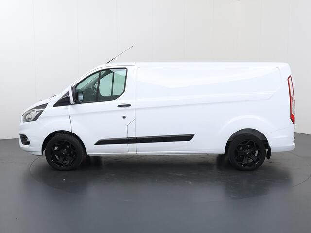Ford TRANSIT CUSTOM 300 2.0 TDCI | 130 PK | L2 H1 | TREND | STOELVERWARMING | PARKEERSENSOREN | TREKHAAK | CARPLAY | ANDROID AUTO | AIRCO | CRUISE | 18" LICHTMETALEN WIELEN | 3-ZITS | VOORRUITVERWARMING