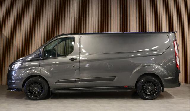 Ford TRANSIT CUSTOM 300 2.0 TDCI L2H1 | Raptor Edition | Blind Spot | Camera | Navigatie | CarPlay | Stoelverwarming | Airco | PDC V+A | MF Stuur | Dealer onderhouden | Fabrieksgarantie tot 05-2027 | Nieuwe APK