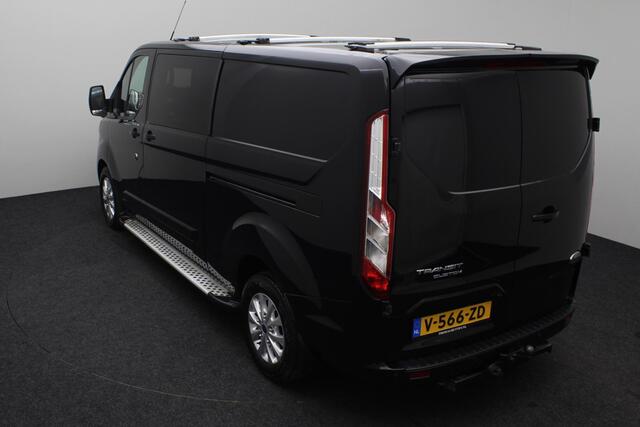 Ford TRANSIT CUSTOM 300 2.0 TDCI L2H1 Limited DC 2019 | Dubbel cabine | 2x schuifdeur | Trekhaak | Airco | Cruise Control | Navigatie | Achteruitrij Camera | DAB Radio | Dakdragers | Parkeersensoren | Boekjes | 2 Sleutels | Nationale Autopas