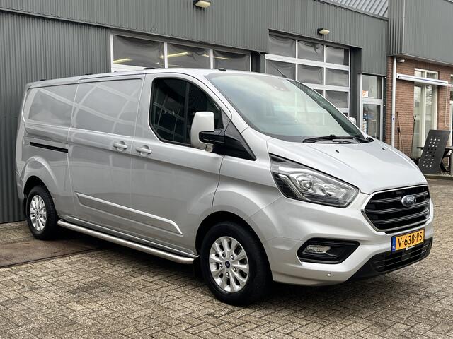 Ford TRANSIT CUSTOM 300 2.0 TDCI L2H1 Limited Airco Cruise control Trekhaak 2800kg trekgewicht 3-Persoons Stoelverwarming Telefoonverbinding Achterruitrij camera Parkeersensoren voor en achter Schuifdeur Euro 6