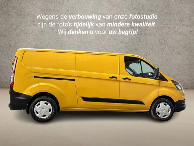 Ford TRANSIT CUSTOM 320 2.0 TDCI L2H1 Deluxe (STOELVERWARMING, BLUETOOTH, ELEK RAMEN, XENON, PARKEERSENSOREN, ARMSTEUN, TREKHAAK, CRUISE, NIEUWE APK, NIEUWSTAAT)