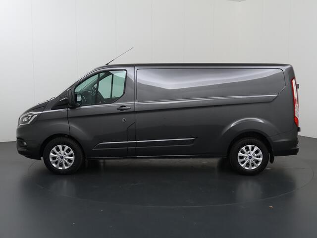 Ford TRANSIT CUSTOM 300 | 2.0 TDCI | Aut. | L2 H1 | Limited | Adaptive Cruise | Stoelverwarming | LM Velgen | 3-zits | Trekhaak | Navigatie | Parkeercamera | Apple Carplay
