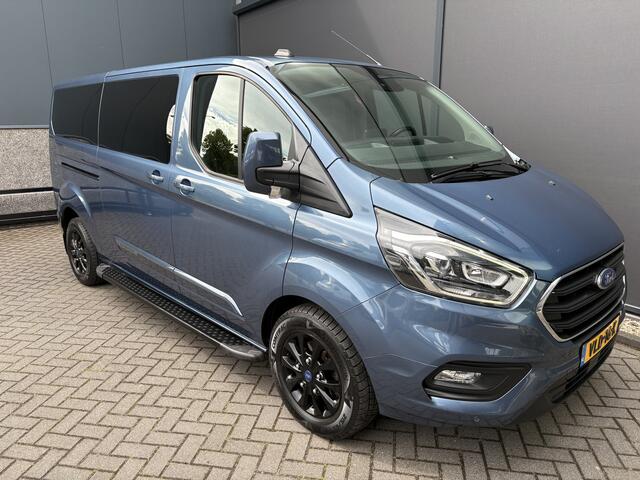 Ford TRANSIT CUSTOM 320 2.0 TDCI L2H1 Platinum Edition DC Automaat Achteruitrijcamera - Parkeersensoren - Navigatie - Airco - Dodehoek detector - Cruise control - Licht metalen velgen 16 inch - Lederen bekleding - Radio - Bluetooth - Dubbele cabine - Tussens - Mistlampen voo