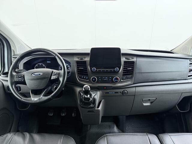 Ford TRANSIT CUSTOM 300 2.0TDCI L2H1 Dubbele Cabine 6-Persoons Trekhaak Navi Camera Cruise Control Imperiaal Airco Stoelverwarming Pdc DC DAB Bluetooth Betonplex Vloer Wandbetimmering 2.750KG Trekgewicht Origineel Nederlandse Auto