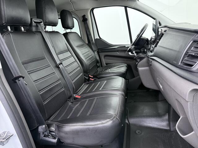 Ford TRANSIT CUSTOM 300 2.0TDCI L2H1 Dubbele Cabine 6-Persoons Trekhaak Navi Camera Cruise Control Imperiaal Airco Stoelverwarming Pdc DC DAB Bluetooth Betonplex Vloer Wandbetimmering 2.750KG Trekgewicht Origineel Nederlandse Auto