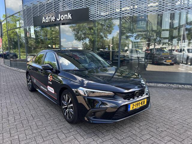 Honda CIVIC 2.0 e:HEV Elegance | AUTOMAAT | SPORTPAKKET | APPLE CARPLAY | ACHTERUITRIJCAMERA | PARKEERSENSOREN | DODEHOEKDETECTIE | ADAPTIEF CRUISE CONTROL | DEMO |