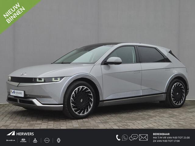 Hyundai IONIQ 5 Lounge 73kWh Automaat / Accu SOH 100% / Fabrieksgarantie tot 10-2026 / Dealer onderhouden / Panoramadak / WLTP 451 km / Afn. trekhaak 1.600 kg / Elektrische klep en stoelen / Stuur-, stoel- en achterbankverwarming /