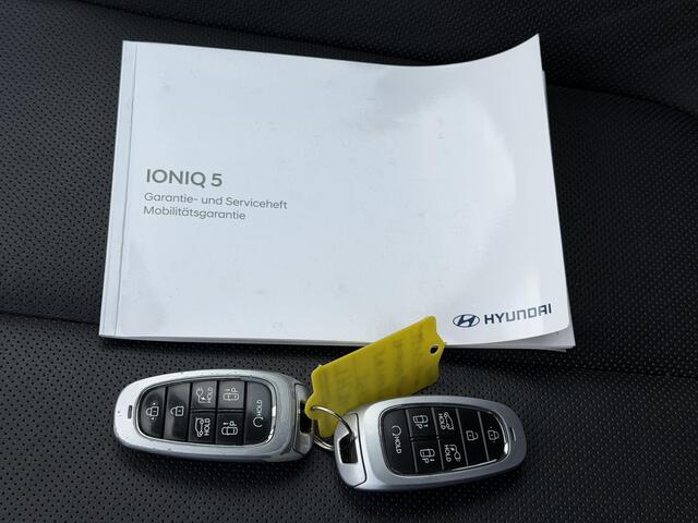 Hyundai IONIQ 5 Lounge 73kWh Automaat / Afn. Trekhaak / Dealer onderhouden / Fabrieksgarantie tot 6-2027 / Warmtepomp / 8 Jaar Batterij Garantie / HUD / CCS snel laden / 360 Camera / Adaptieve Cruise / Lederen Bekleding / Elektr. Stoelen / Stoel Verwarming / Stoel Vent