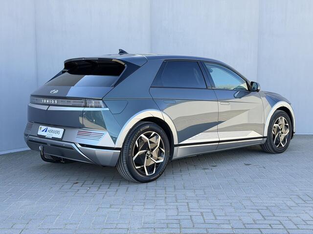 Hyundai IONIQ 5 Lounge 73kWh Automaat / SOH 100% / Panoramadak / Afneembare Trekhaak / WLTP 481 km / Warmtepomp / HUD / BOSE / 360 Camera / Apple Carplay & Android Auto / Elektr Stoelen + memory / Stoel Verwarming + Ventilatie / Navigatie / Adaptieve Cruise / DAB / Dod