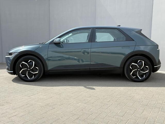 Hyundai IONIQ 5 Style 77.4 kWh / SOH 100% / Fabrieksgarantie t/m 12-2027 / Dealer onderhouden / Weinig km / Warmtepomp / CCS snel laden / Adaptieve Cruise Control / Navigatie / Apple Carplay Android / 19" LM wielen /