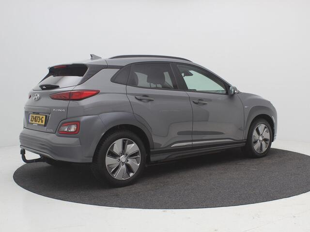 Hyundai Kona EV Premium 64 kWh / 100% SoH / Trekhaak / 1ste eigenaar / Dealer onderhouden / Navigatie / Lederen bekleding / Adaptieve Cruise Control / Airco Climat Control / NL Auto /