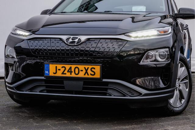 Hyundai Kona EV Fashion 64 kWh Trekhaak/ Schuif-kanteldak/ Stoelverwarming/ Half lederen int./ HUD/ Blindspot