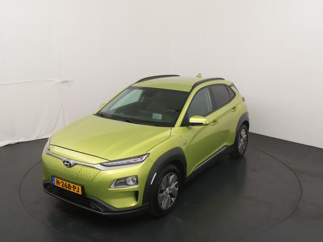 Hyundai Kona EV Premium 64 kWh | Trekhaak | Voorstoelen vewarmd&verkoeld | Warmtepomp | Adapt. Cruise | HUD | Leder |