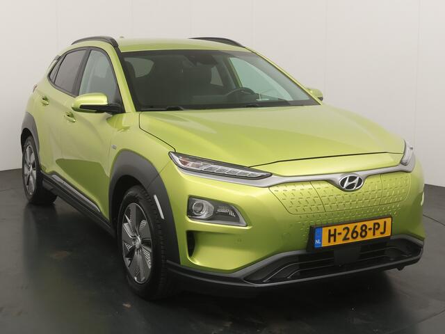 Hyundai Kona EV Premium 64 kWh | Trekhaak | Voorstoelen vewarmd&verkoeld | Warmtepomp | Adapt. Cruise | HUD | Leder |