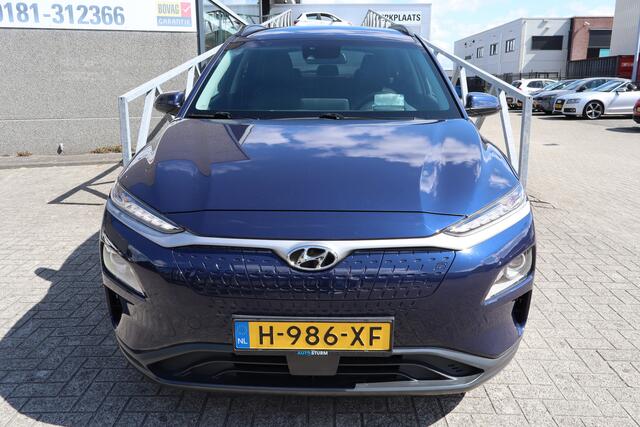 Hyundai Kona EV Fashion 64 kWh Nederlandse auto/Stoelverwarming/Achteruitrijcamera/Apple carplay/Warmtepomp/Adaptieve cruise control/Lane assist/Dodehoek assistent/Climate control/Navigatie