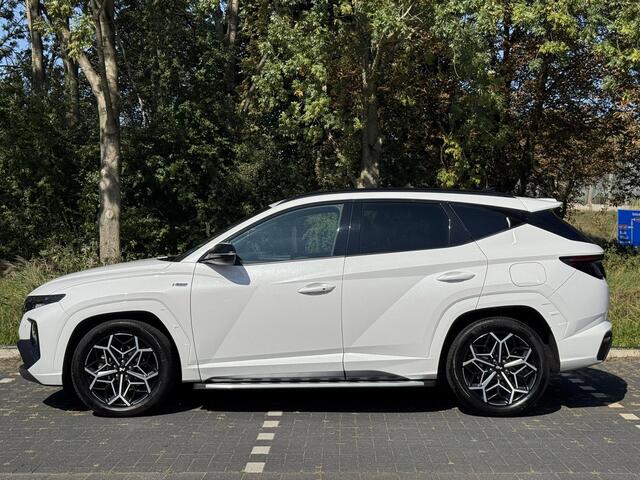 Hyundai TUCSON 1.6 T-GDI HEV N Line | Sidesteps | 1650 kg trekvermogen | Geïntegreerde navigatiesysteem | Stoelverwarming | Android Auto & Apple Carplay | 19'' Lichtmetalen velgen |