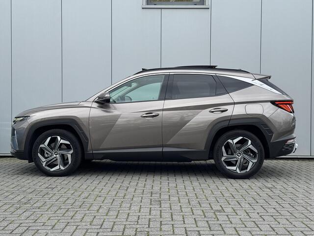Hyundai TUCSON 1.6 T-GDI HEV Premium Sky Eerste eigenaar/ Dealer onderhouden / Glazen schuif- en kanteldak / Trekgewicht 1650 Kg/ Trekhaak / Elektrische achterklep / Adaptief cruise control / Stuur- en Stoelverwarming / Stoelventilatie /