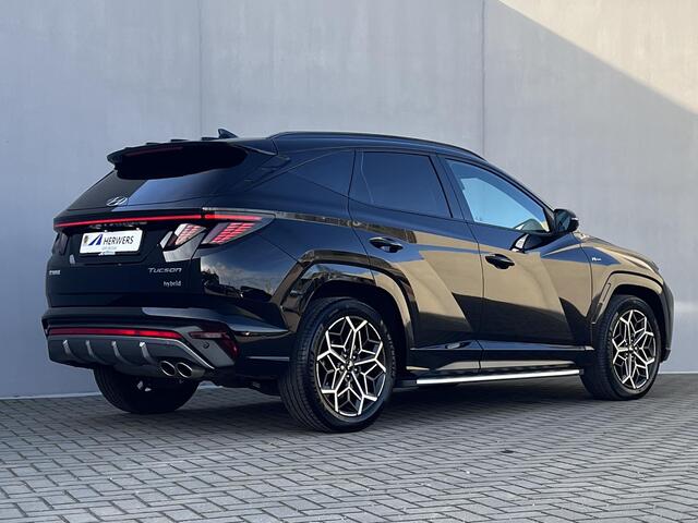 Hyundai TUCSON 1.6 T-GDI HEV 230pk N Line Sky Fabrieksgarantie tot 04-2029 / Dealer onderhouden / 1.650kg Trekgewicht / Panorama schuifdak / Stuur-, stoel- en achterbankverwarming / Apple Carplay Android / 19" LM wielen /