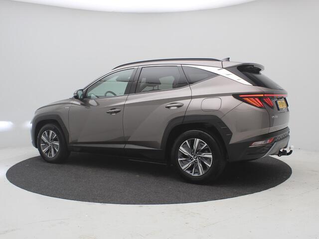 Hyundai TUCSON 1.6 T-GDI MHEV Comfort Smart / Lage KM-stand 12994 km / 1ste Eigenaar / Navigatie / Trekhaak / 1650KG Trekgewicht / Camera / Climate & Cruise Control / Elektrische Achterklep / Krell Audio / Navigatie / Stoelverwarming / Apple Carplay / Fabrieksgarantie t