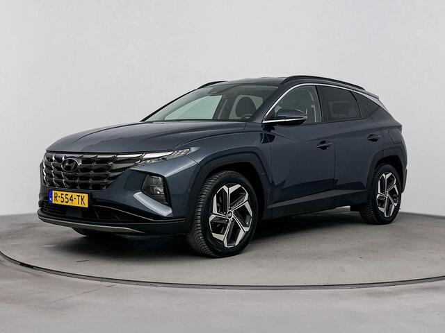 Hyundai TUCSON 1.6 T-GDI HEV Premium | All season banden | Parkeersensoren | Lederenbekleding | Metallic lak |