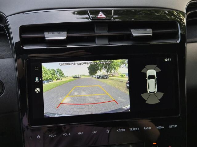 Hyundai TUCSON 1.6 T-GDI PHEV N Line Edition 4WD / Fabrieksgarantie tot 05-2027 / Dealer onderhouden / Afn. trekhaak 1.350 kg / Elektrische klep / Stuur- & stoelverwarming / Navigatie / Apple Carplay Android / 19" LM wielen / Krell Audio Systeem /