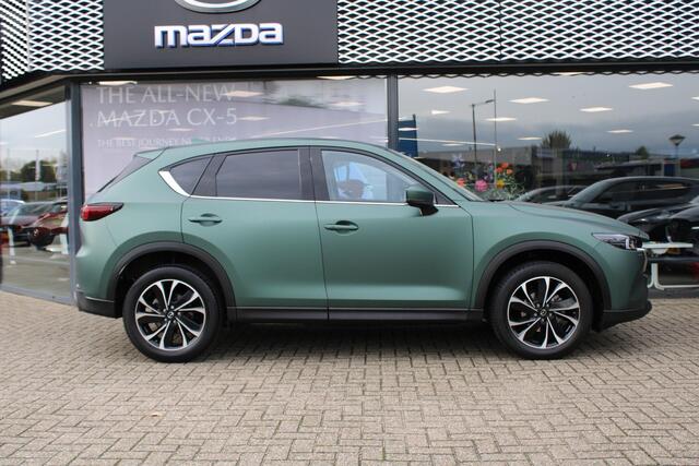 Mazda CX-5 2.0 e-SkyActiv-G M Hybrid 165 Exclusive-Line+Com.P , Automaat, Matte Metallic Pine Green gewrapped, Black Comfort Pack, Navi, Adap.Cruise, Clima, Apple Carplay, 360 Camera, PDC, HUD, Stuur/Stoelverwarming, 19" LMV