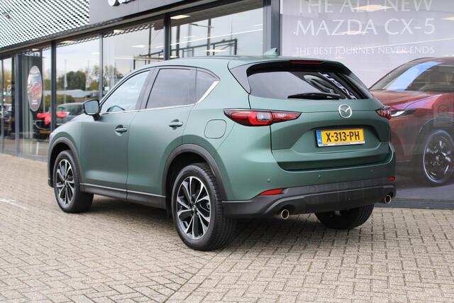 Mazda CX-5 2.0 e-SkyActiv-G M Hybrid 165 Exclusive-Line+Com.P , Automaat, Matte Metallic Pine Green gewrapped, Black Comfort Pack, Navi, Adap.Cruise, Clima, Apple Carplay, 360 Camera, PDC, HUD, Stuur/Stoelverwarming, 19" LMV