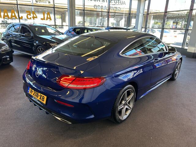 Mercedes-Benz C-KLASSE Coupé 180 AMG Exclusive | Automaat | Lederen bekleding | Dealer onderhouden | Adaptief onderstel | Achteruitrijcamera | Cruise control | Climate control | Houtafwerking interieur