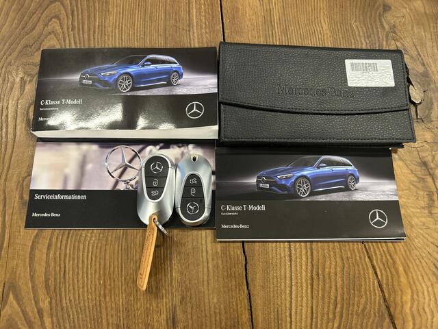 Mercedes-Benz C-KLASSE Estate 180 AMG Line | Panoramadak | Sfeerverlichting | Achteruitrijcamera | Cruise control | Adaptief onderstel | Lane assist | Dodehoeksdetectie | Stoelverwarming | Apple carplay