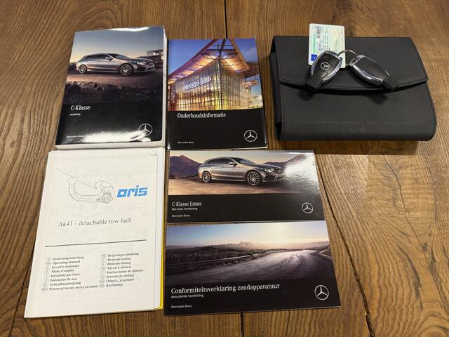 Mercedes-Benz C-KLASSE Estate 180 AMG Line | Panoramadak | Lederen bekleding | Trekhaak | Cruise control | Climate control | Nederlands geleverd | Stoelverwarming | Elek. inklapbare spiegels