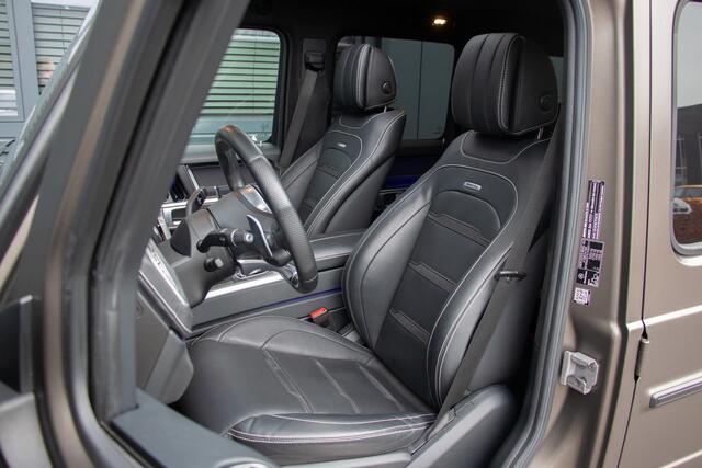 Mercedes-Benz G-KLASSE - 63 AMG 585PK | Burmester 3D | Massage + Ventilatie | Akrapovic | 360 Camera | Carbon | IWC | Lane & Side Assist | MBUX | TH 3500kg | 22"| Manufaktur | Ambiance | Garageopener | N.P ¤275.681,-