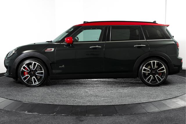 Mini CLUBMAN 2.0 JCW ALL4 Chili | S/K-Panodak | Adapt. Cruise | Stoelverw. | PDC | Camera | NAV + App.Connect | ECC | Harman Kardon | LM 19" |