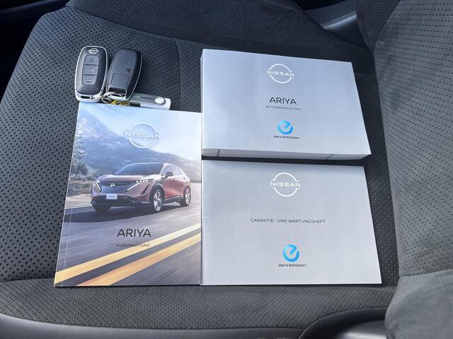 Nissan Ariya Evolve 91 kWh Automaat / Weinig km / Elektr. Schuifdak, stoelen en klep / Navigatie / Stoelverwarming / Stoelventilatie / 20" LM wielen & All Season banden / Apple Carplay Android /