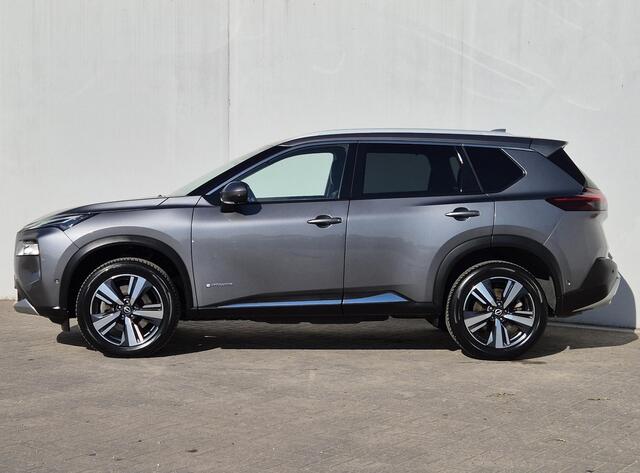 Nissan X-TRAIL 1.5 e-Power Tekna Automaat / Cold Pack / HUD / Stoel-, Stuur en Achterbankverwarming / Rondomzicht camera / Allseason Banden / Elektrische achterklep / Adaptief CC / Apple Carplay Android Auto /