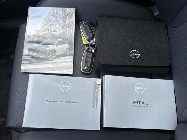 Nissan X-TRAIL 1.5 e-4orce Tekna 4WD Automaat / 1800 kg Trekgewicht / Fabrieksgarantie tot 07-2028<100.000km / Dealer onderhouden / All Season banden / Head Up Display / Elektrische achterklep / Adaptief cruise control / Rondomzicht camera /