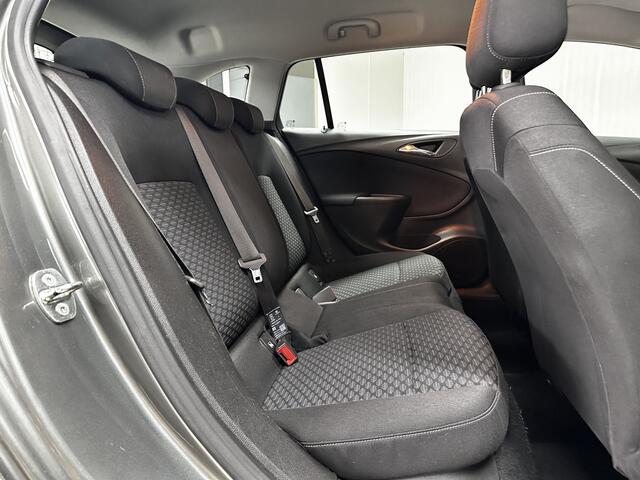 Opel ASTRA Sports Tourer 1.0 Online Edition/ PDC V+A/ Apple + Android/ DAB+/ Navi/ Airco/ Cruise/ Elek. pakket/ Isofix/ Bluetooth/ Armsteun/ Multi. LEDER. Stuur/ LED Dagrijverl.